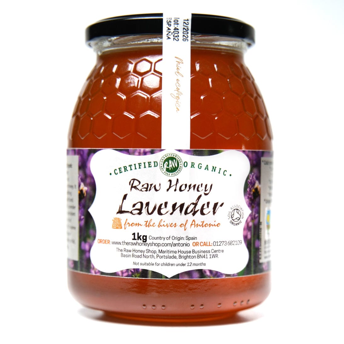 Large glass jar containing 1kg of golden raw organic lavender honey