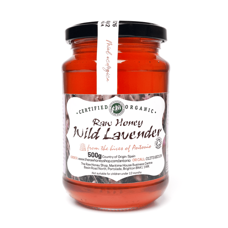 Glass jar containing 500g of raw organic wild lavender honey