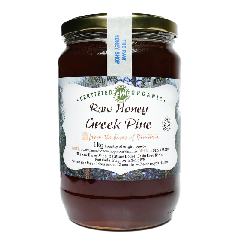 Large labelled glass jar containing 1kg of dark raw organic Greek pine honey.