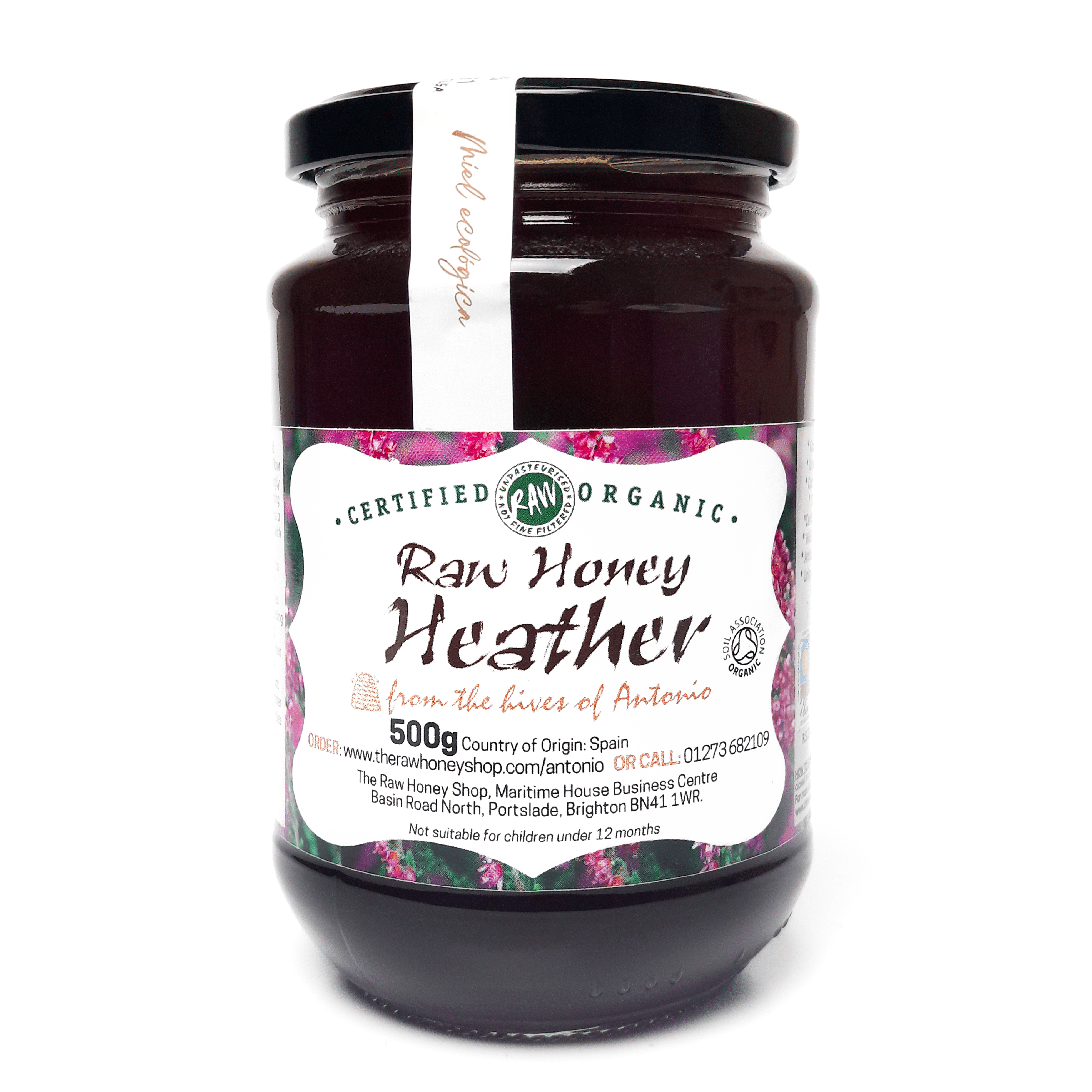 Glass jar containing 500g of raw organic heather honey