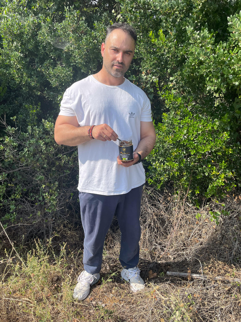 Kostas in front of a Mediterranean (Holm)Oak with a jar of his Oak honey. Taken in the Peloponnese where his hives are.