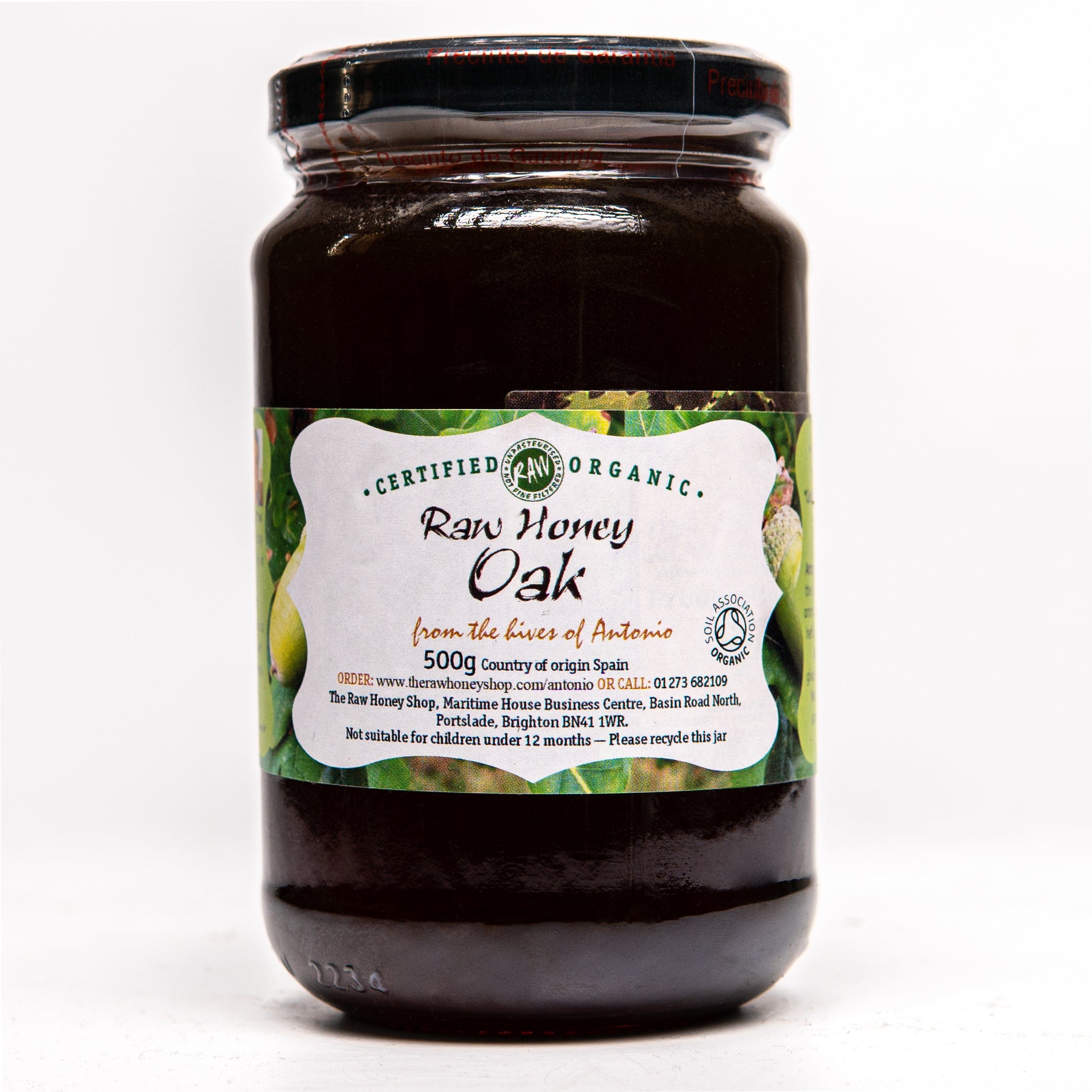 glass jar containing 500g of dark raw organic chestnut honey