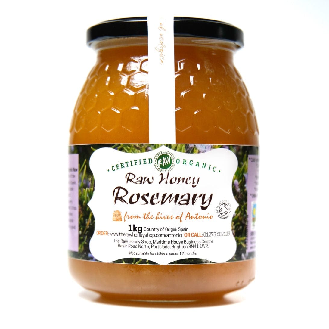 Large glass jar containing 1kg of golden raw organic rosemary honey