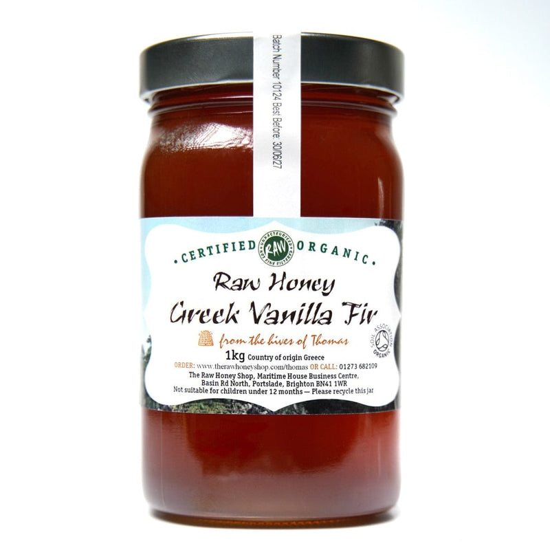 Large labelled glass jar containing 1kg of dark raw organic Greek vanilla fir honey