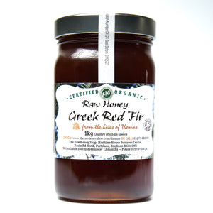 Large labelled glass jar containing 1kg of dark raw Greek red fir honey