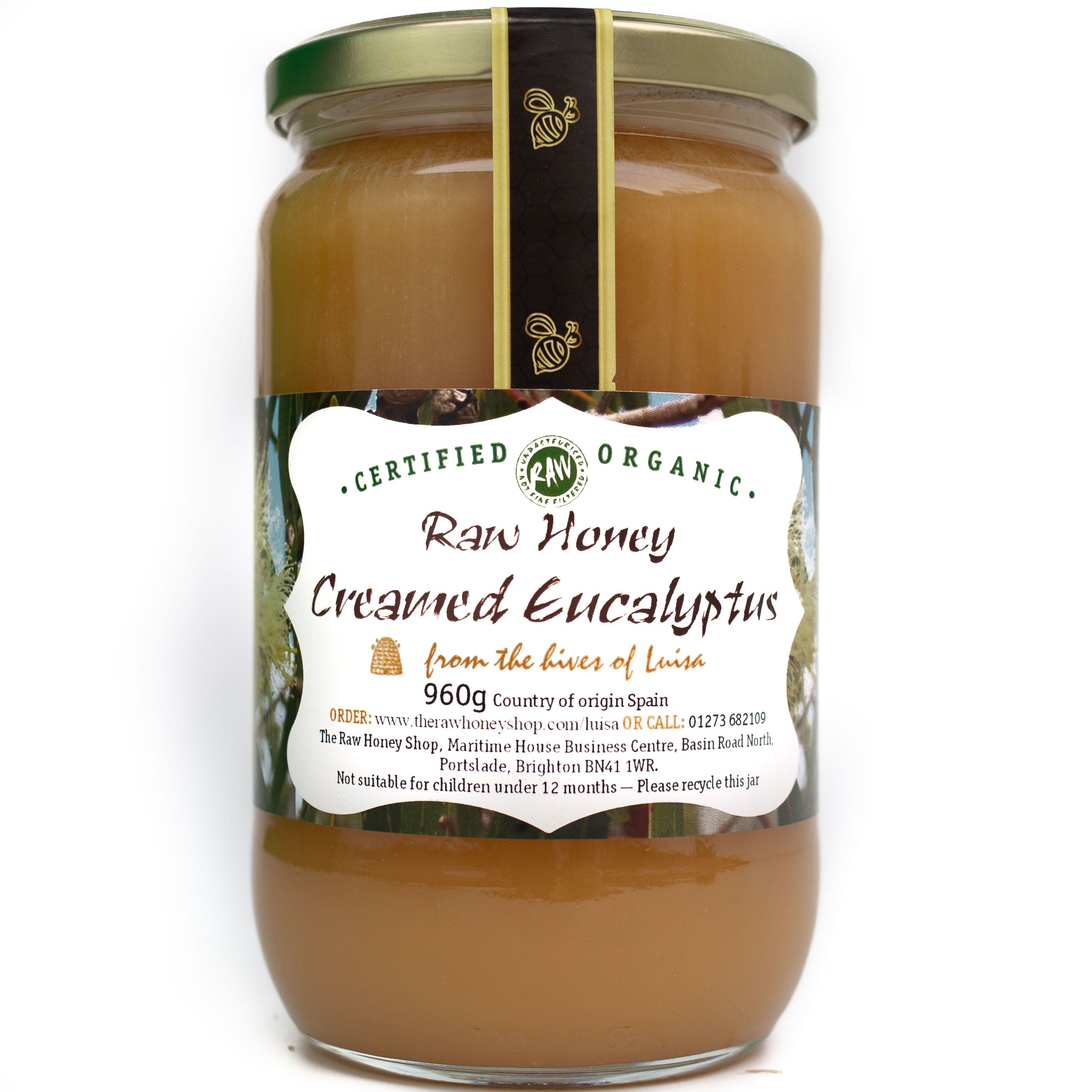 Large glass jar containing 960g of toffee coloured raw organic eucalyptus creamed honey